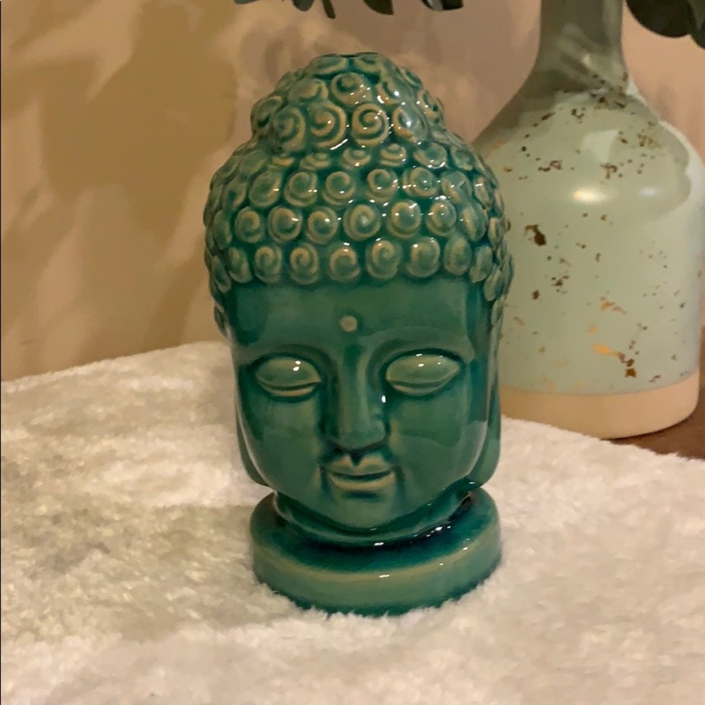Teal green buddha head glass